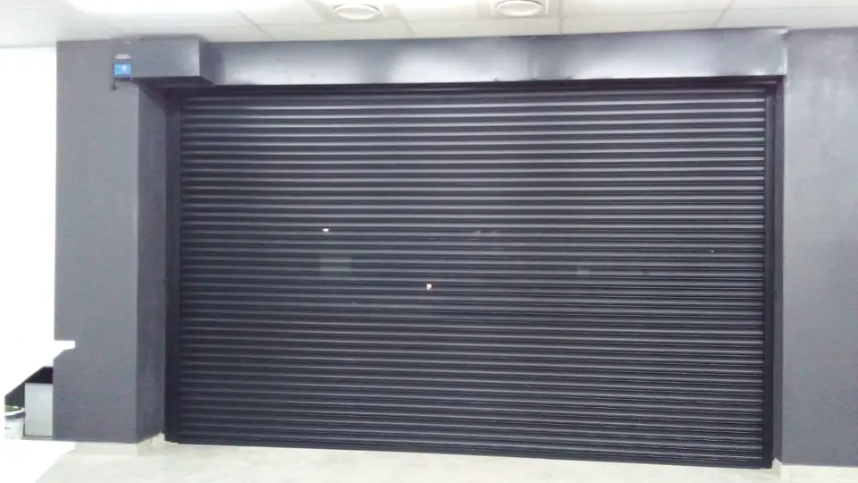 Charcoal powder-coated roller door with a modern finish