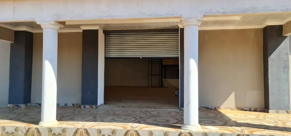 Roller doors between columns on a retail building