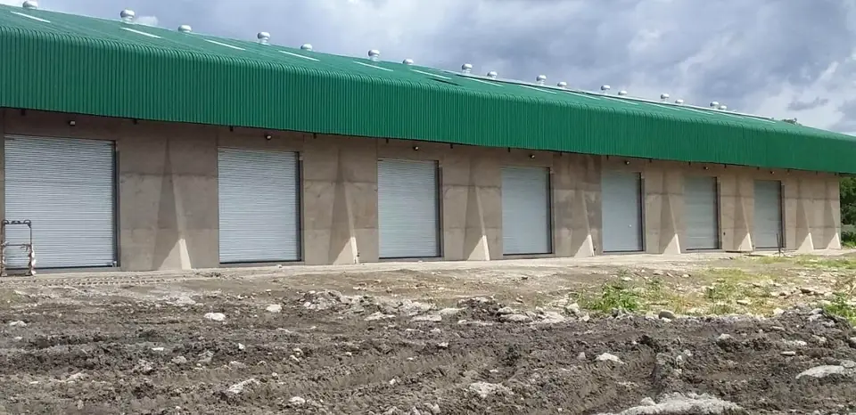 Long row of roller doors on a mini-storage building