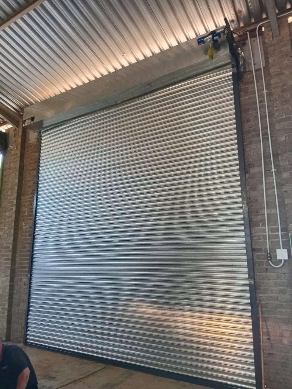 Tall galvanised industrial roller door with chain operation
