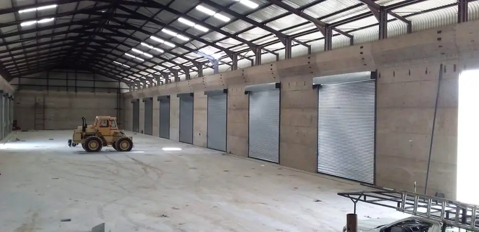 Inside a new warehouse lined with industrial roller shutter doors